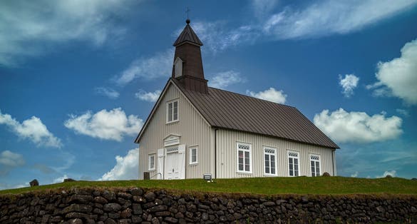 photo of view of The picturesque Strandarkirkja church in Selvogur, on the southern coast of Iceland.