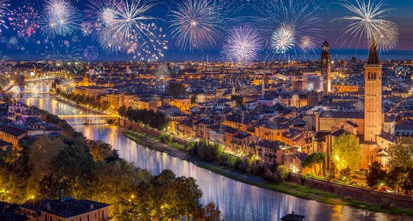 Colorful Fireworks above Verona Cityscape, in Italy, Celebrating New Years Eve.