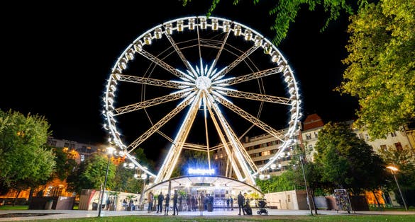 Photo of Budapest Eye (ferris wheel) at Erzsebet Square. Luminous Ferris wheel in night city, Budapest, Hungary.