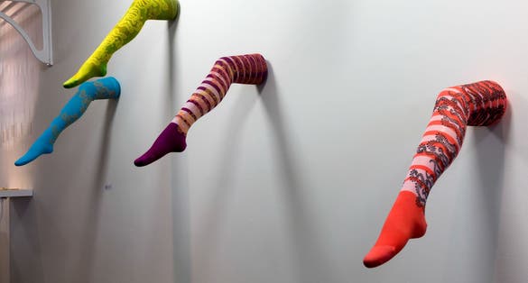 Ladies legs in colourful tights art display in the Millennium Centre in Cardiff Wales.