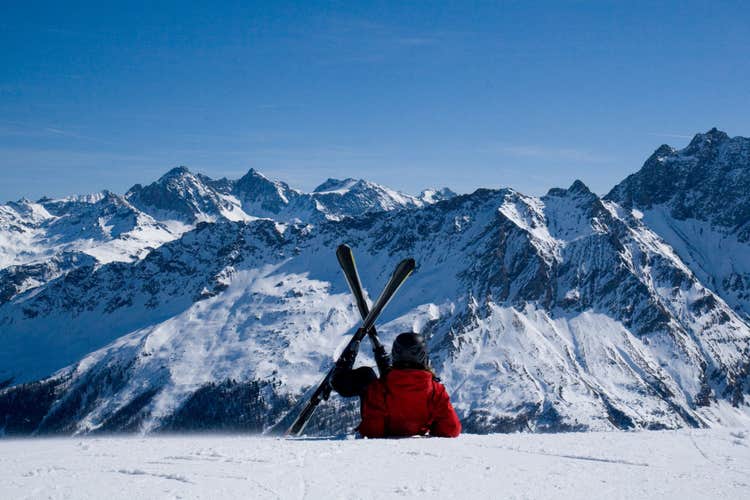 photo of view of Skiing in Savognin. A skier lying on the slope. Swiss Alps.