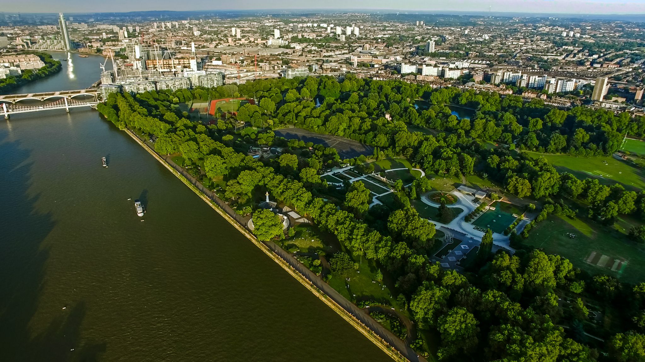 Photo of aerial View of Battersea Park feat. River Thames and Chelsea Bridge in London, UK.