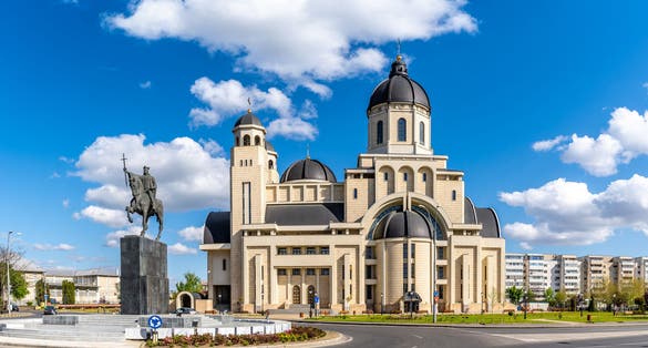 photo of view of The statue of Stefan Cel Mare and Cathedral in center of Bacau city, Moldavia landmark, Romania