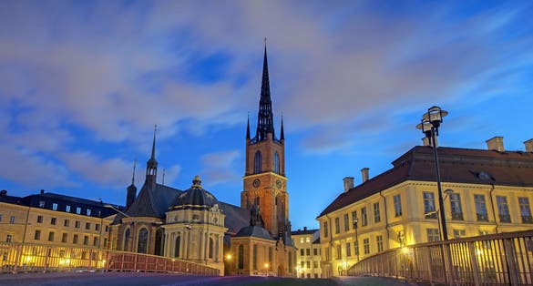 photo of Riddarholm Church at night in Stockholm, Sweden.