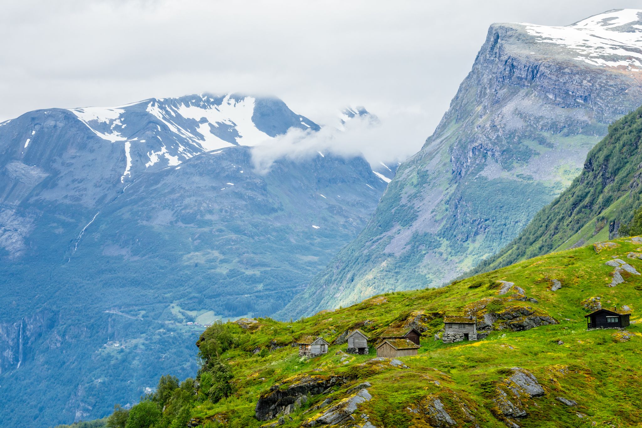 Norwegian mountain village with traditional turf roof houses, Geiranger, Sunnmore region, More og Romsdal county, Norway