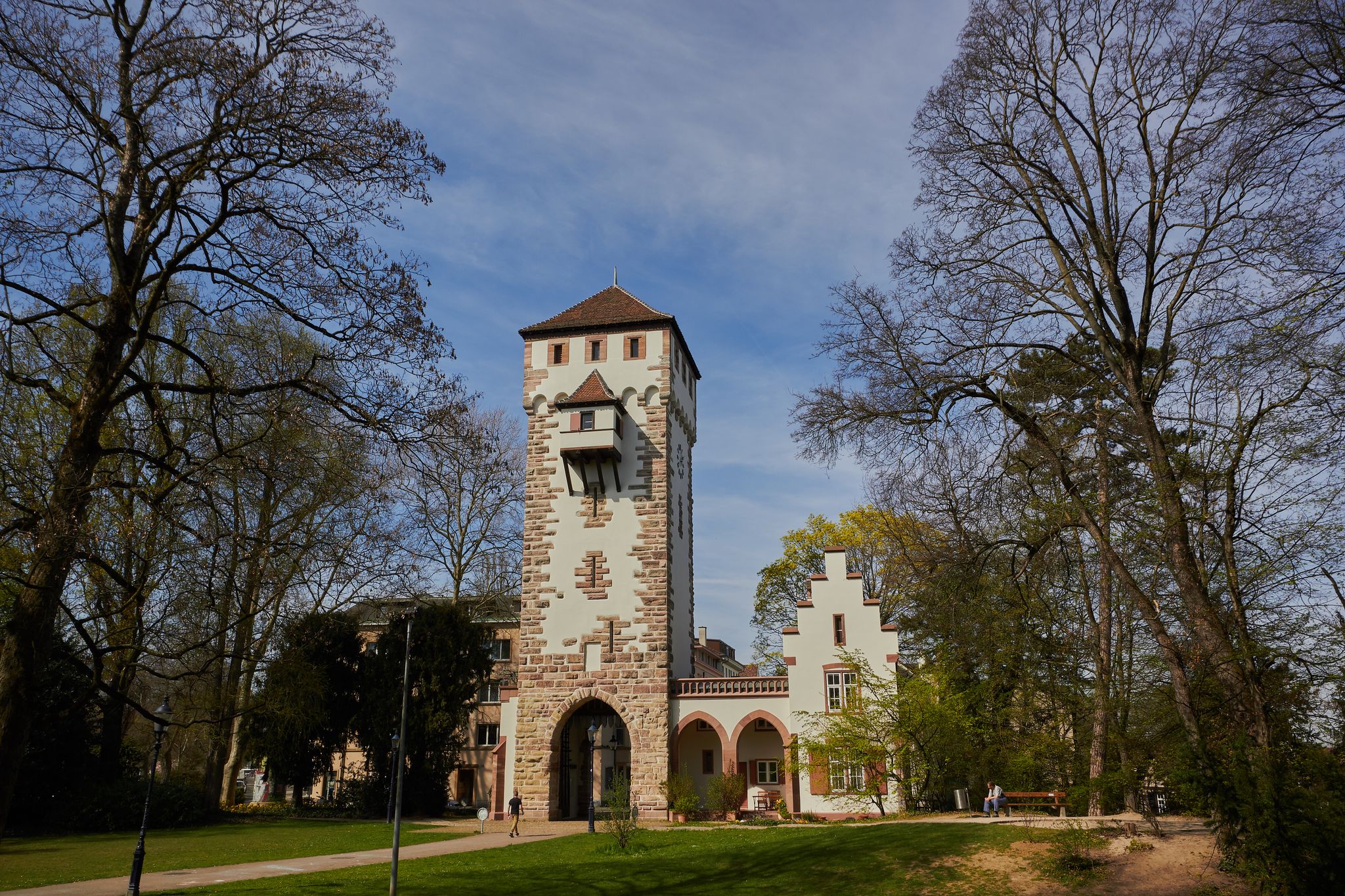 photo of tourists on St-Alban City Gate at evening in Basel, Switzerland.