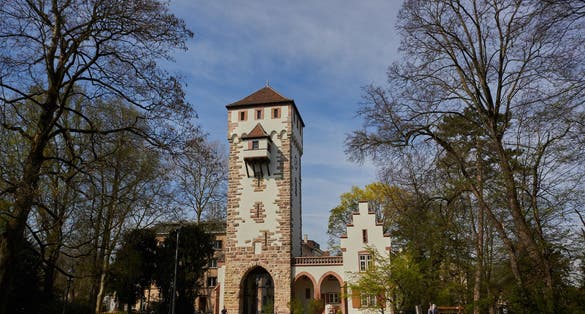 photo of tourists on St-Alban City Gate at evening in Basel, Switzerland.