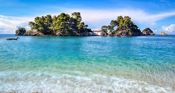 Photo of Panagia isle at Parga in Greece, Ionian sea and a sandy beach.