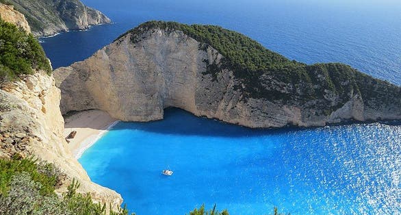photo of aerial view of Navagio beach, Zakynthos, Greece.