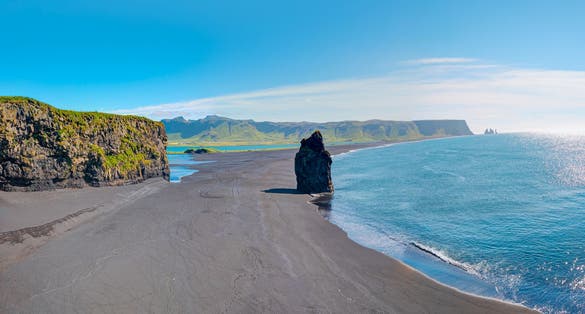 photo of reynisfjara black sand beach, near the village of vik, Iceland