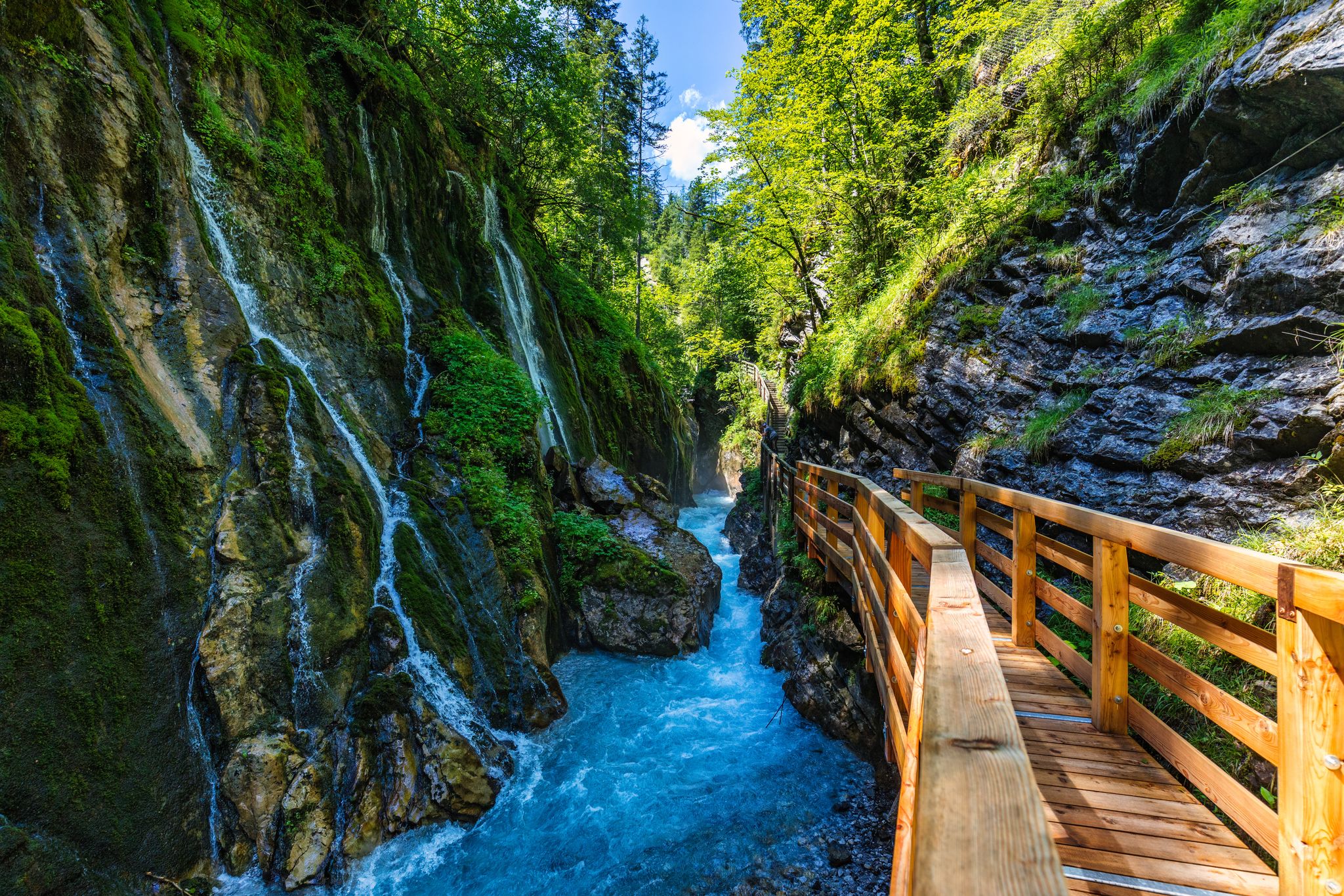 Photo of Beautiful Wimbachklamm gorge with wooden path in autumn colors, Ramsau bei Berchtesgaden in Germany. Waterfall at Wimbachklamm near Ramsau-Berchtesgaden, Bavaria, Germany.