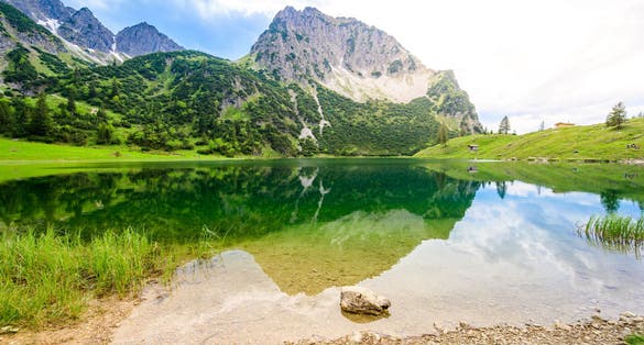 Photo of Beautiful landscape scenery of the Gaisalpsee and Rubihorn Mountain at Oberstdorf, Reflection in Mountain Lake, Allgau Alps, Bavaria, Germany .