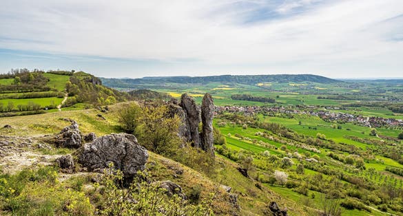 Photo of Ehrenbuergstein and the walberla rock, the stone woman, near village Kirchehrenbach, county Forchheim, upper franconia, bavaria, germany.