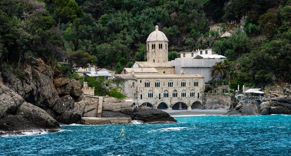 photo of view San Fruttuoso abbey in Camogli, Liguria, Italy.