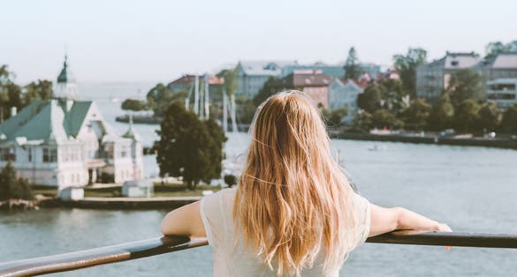 Photo of woman sightseeing Helsinki city landmarks, Finland.