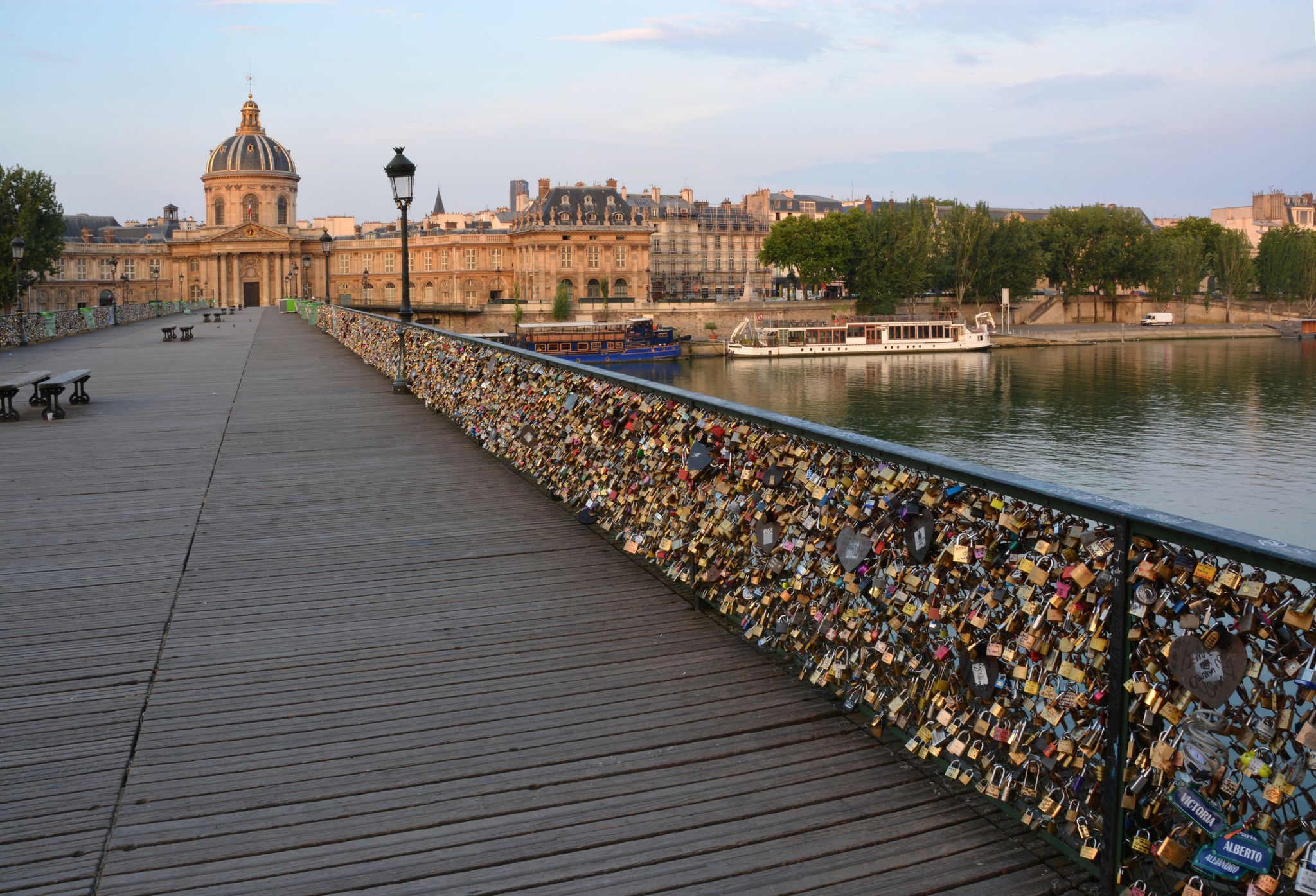 photo of the hundreds of thousands of romantically love inscribed padlocks on the Pont des Arts Bridge, Paris, France.