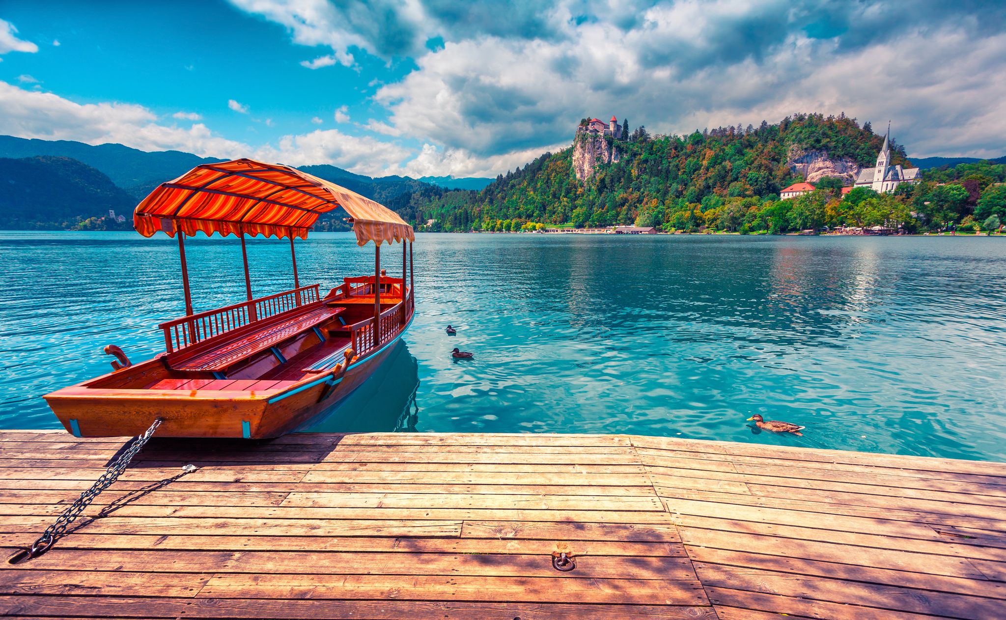 Lake Bled (Blejsko jezero) is a glacial lake in the Julian Alps in northwestern Slovenia, where it adjoins the town of Bled and is overlooked by Bled Castle. Instagram toning.