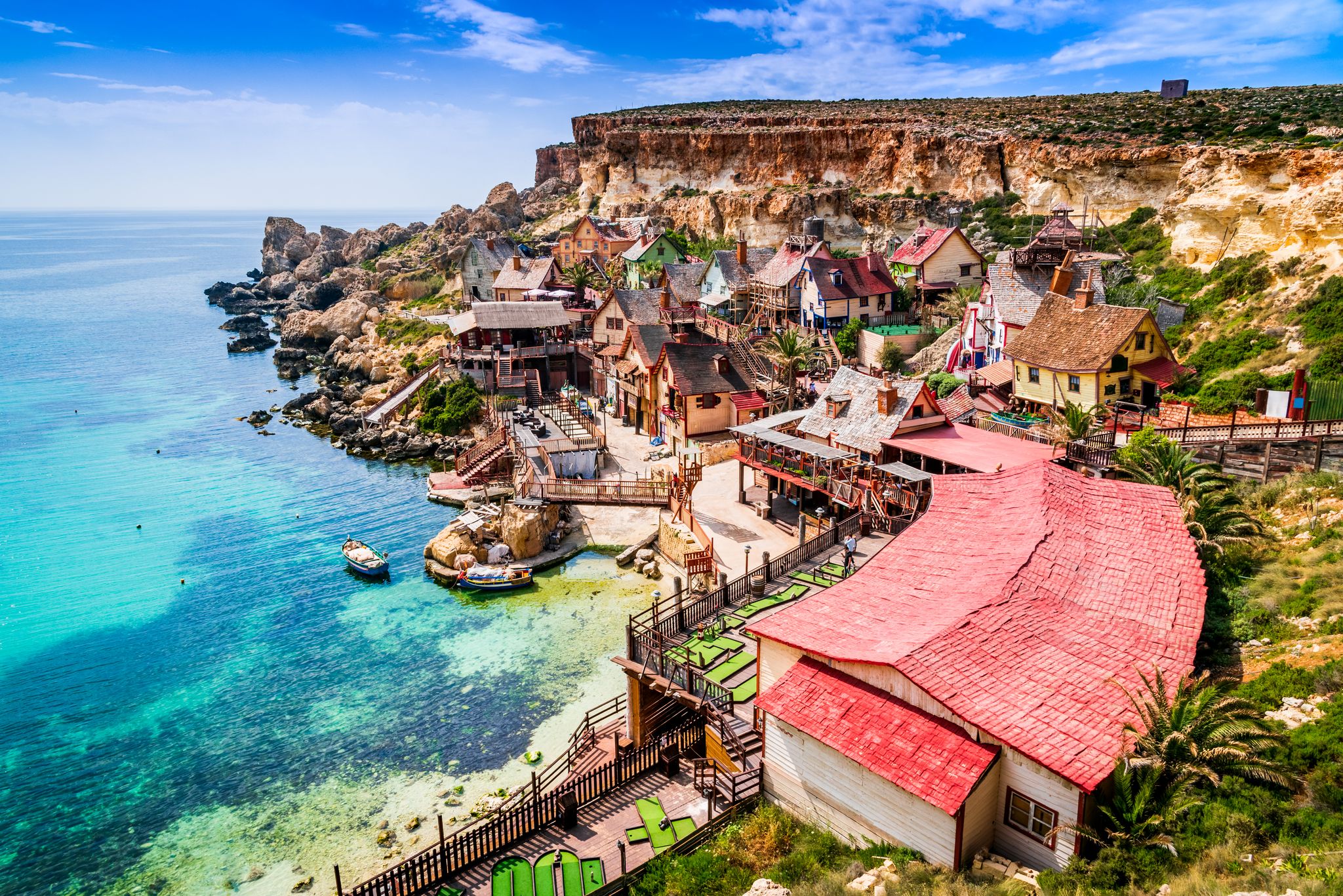 Photo of aerial view of famous Popeye village on a sunny day, Mellieha , Malta.
