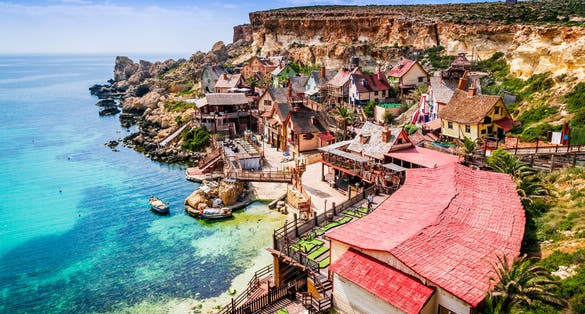 Photo of aerial view of famous Popeye village on a sunny day, Mellieha , Malta.