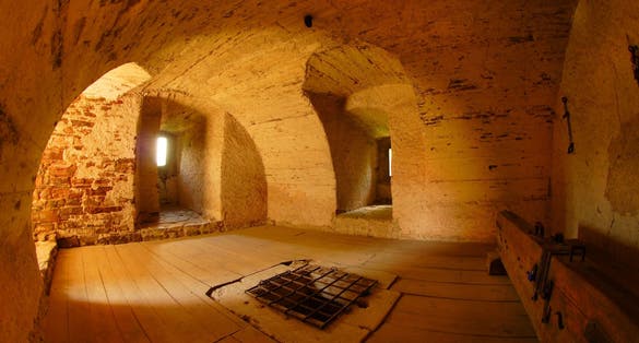 Photo of Pernstejn castle entry into dungeon and torture clog, Czech republic.