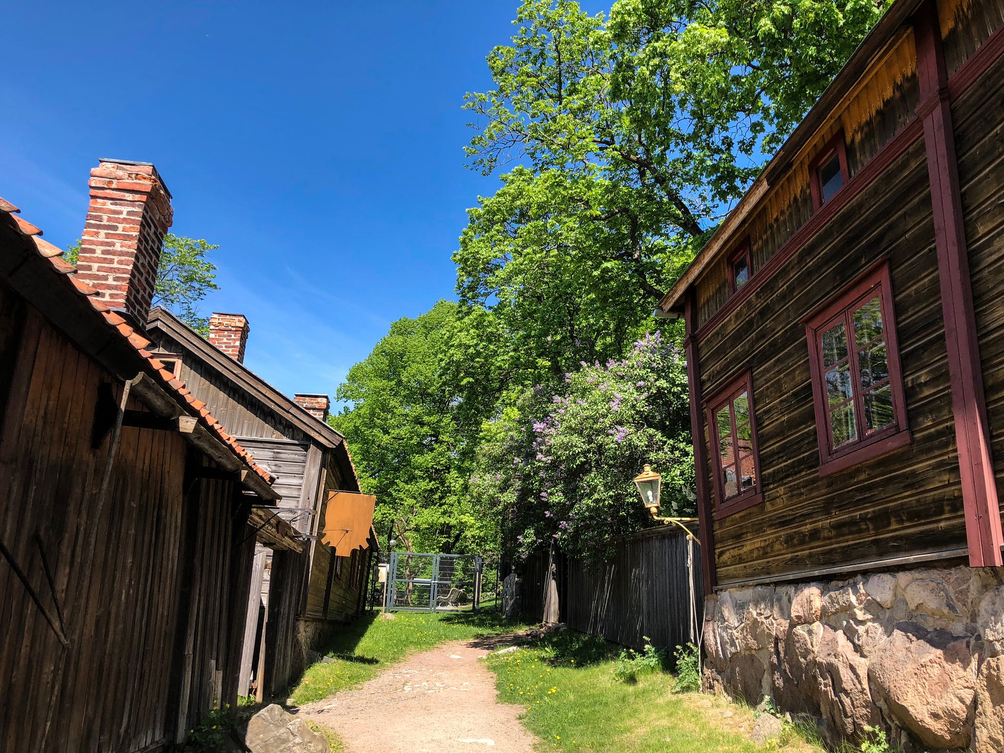 A street in an old Scandinavian village on a sunny day.