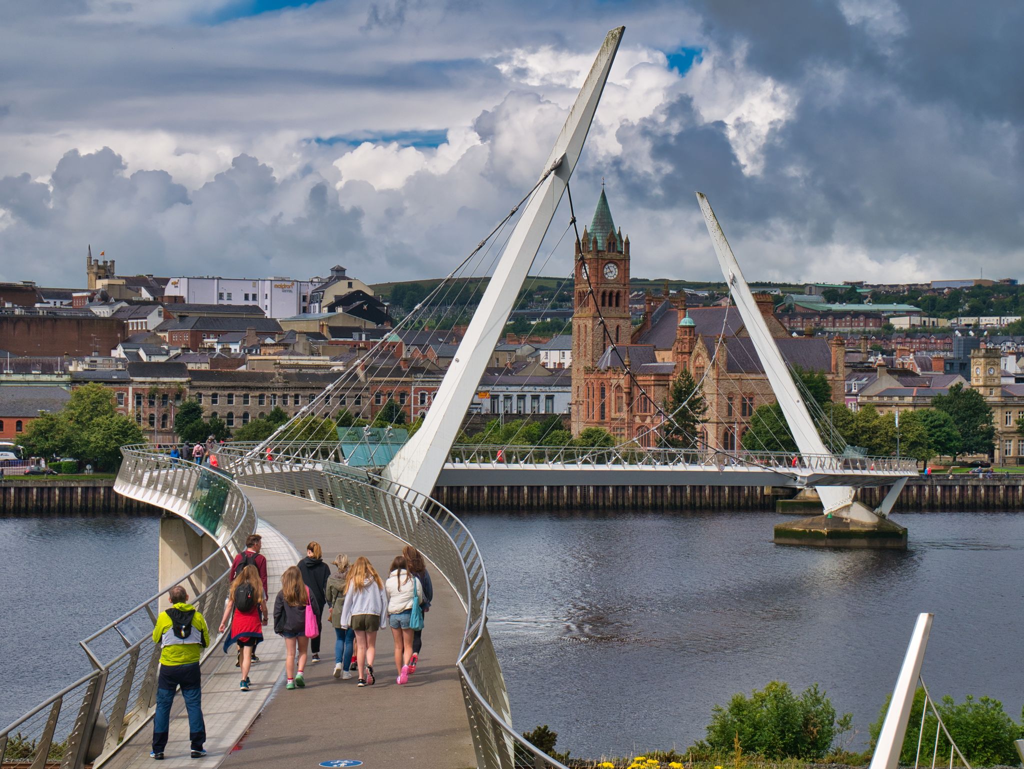 The Peace Bridge across the River Foyle in Derry - Londonderry in Northern Ireland, UK. The bridge links the "Waterside" and "Cityside" areas of the city.