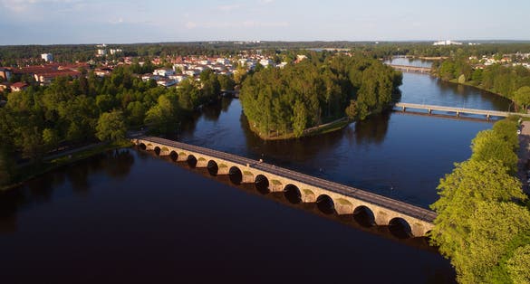 Photo of the Ostra Bron or Eastern bridge, in Karlstad, Sweden. It is Sweden's longest arched stone Bridge.