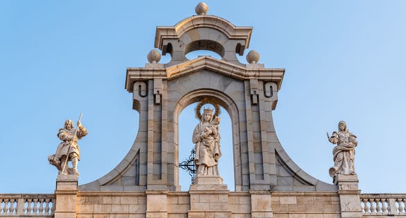 Photo of Almudena Cathedral of Madrid. Exterior detail of Virgin Sculpture above entrance.