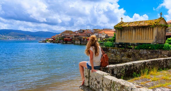 Photo of woman tourist in Galicia, Combarro, Pontevedra in Spain.