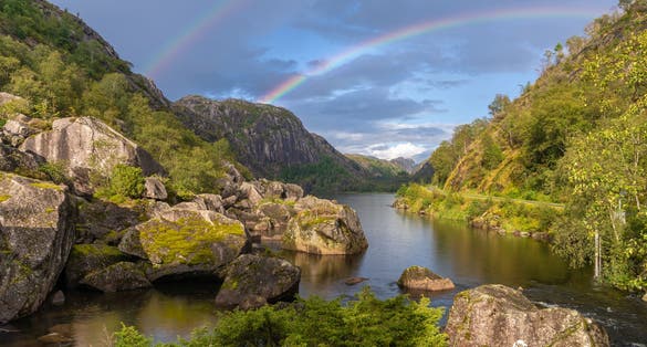 Photo of a beautiful double rainbow on the backroads of southern Norway, near Kristiansand.