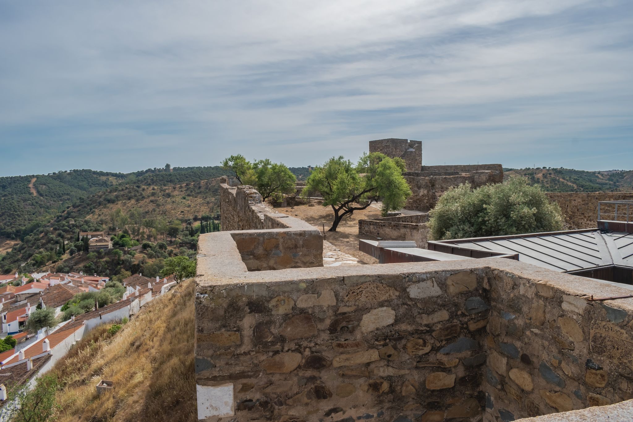 Photo of Wall of the Castle of Mértola on a hill with houses, Alentejo PORTUGAL.