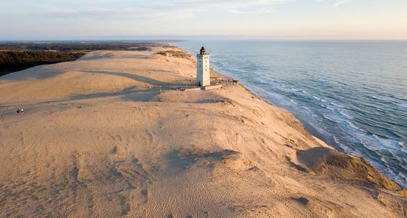 Photo of aerial view of Rubjerg Knude Fyr, lighthouse on the dune near Lønstrup, Denmark.