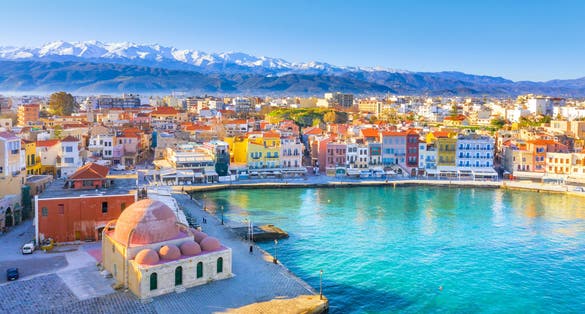 Photo of aerial view of Chania with the amazing lighthouse, mosque, venetian shipyards, Crete, Greece.