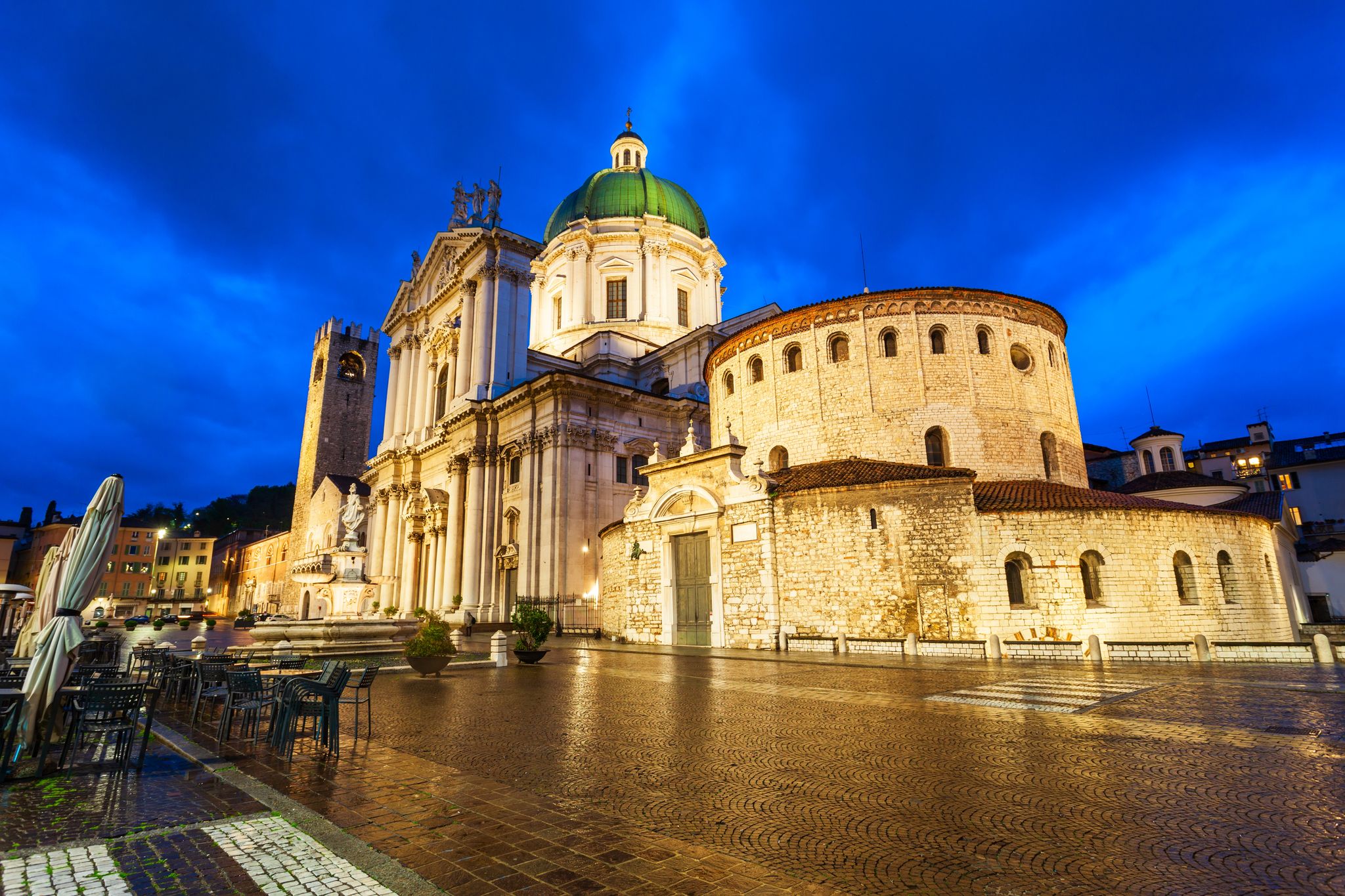 photo of view of New Cathedral or Duomo Nuovo and Old Cathedral or Duomo Vecchio at the Piazza Paolo square in Brescia, Italy.