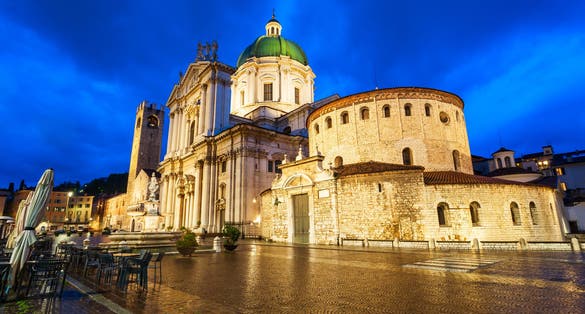 photo of view of New Cathedral or Duomo Nuovo and Old Cathedral or Duomo Vecchio at the Piazza Paolo square in Brescia, Italy.