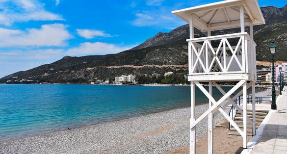 Photo of lifeguard tower in Loutraki beautiful beach, Greece.