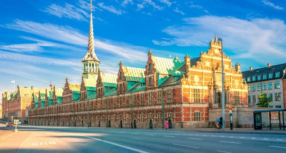 Photo of the Stock Exchange "Børsen" imposing, 17th-century, former stock exchange with a striking spire, historical place in the center of Copenhagen, Denmark.
