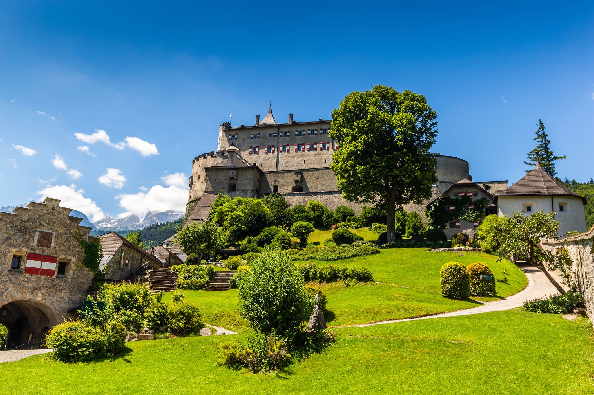 Hohenwerfen Castle or Festung Hohenwerfen aerial panoramic view. Hohenwerfen is a medieval rock castle overlooking the Austrian Werfen town in Salzach valley, Austria