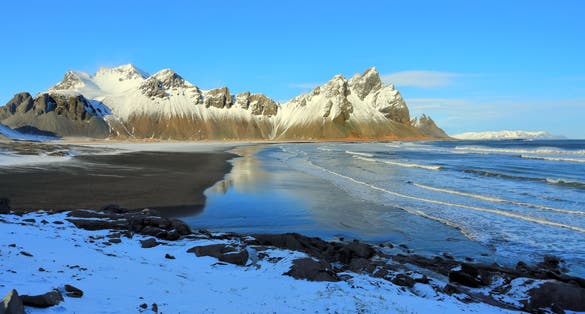 photo of view of Black sand beach and Vestrahorn Mountain, Stokksnes, east Höfn, Austurland, Höfn, Iceland.