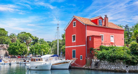 Photo of Fisherman's red house on the water, Croatia, Zadar.