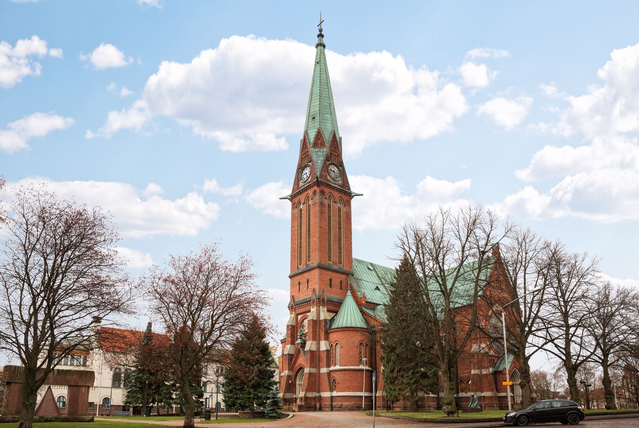 Photo of Lutheran Church in Kotka (Kotkan kirkko), main church in city, is built of red brick in the Neo-Gothic style. Kotka, Finland.