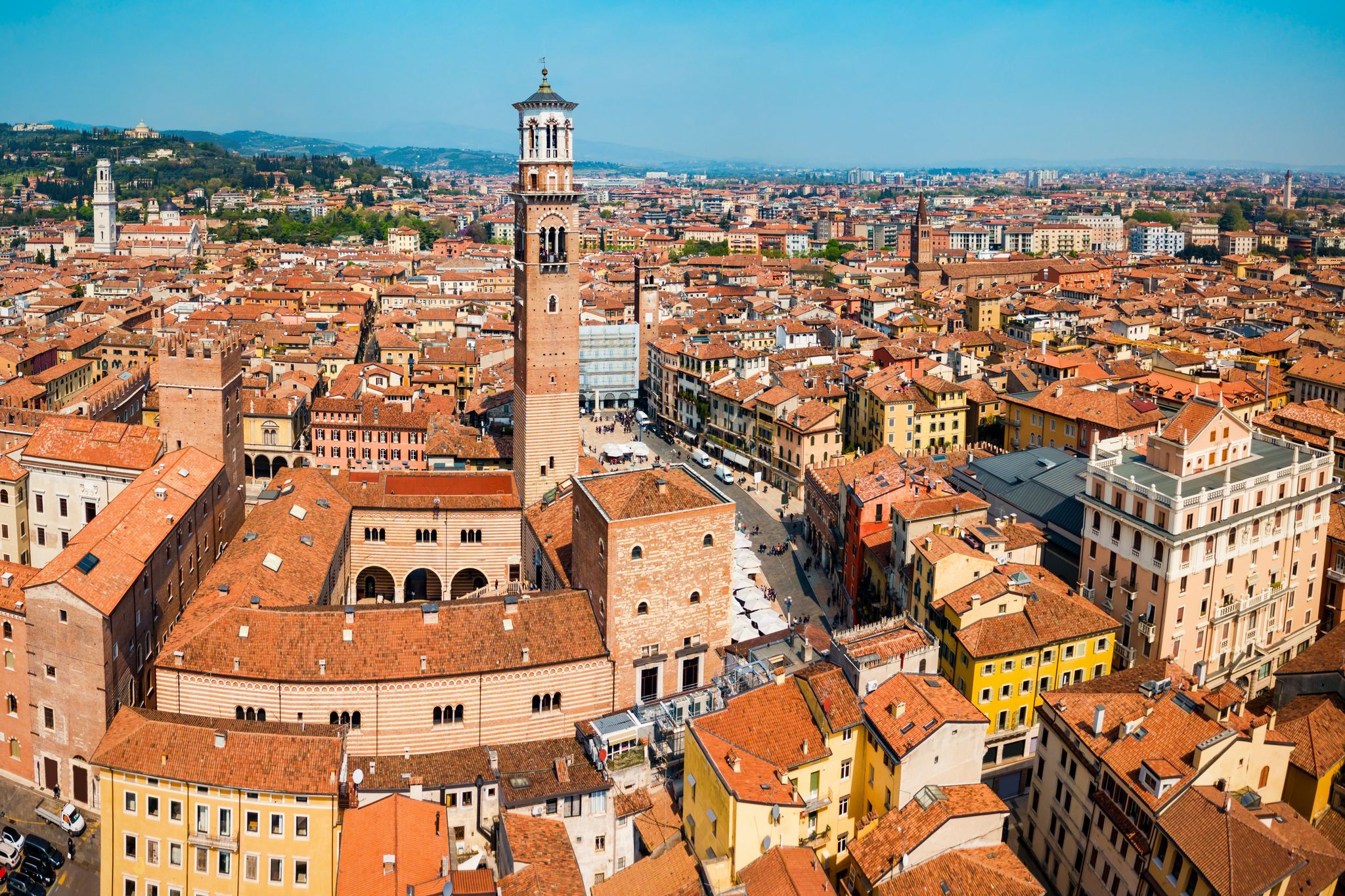 photo of Torre dei Lamberti aerial panoramic view. Torre Lamberti is tower in Piazza delle Erbe square in Verona, Veneto region in Italy.