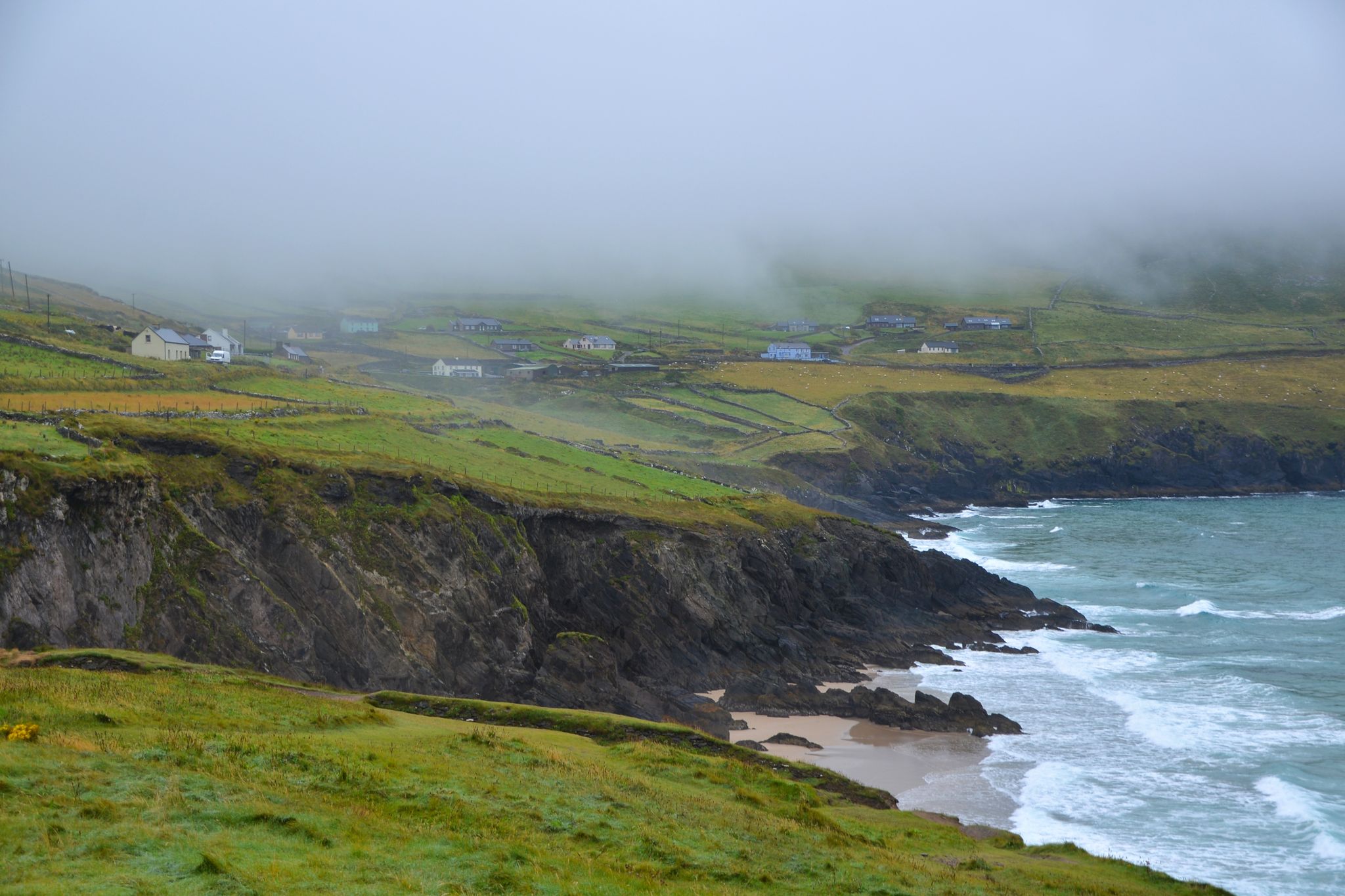 photo of A small village near the dramatic coastline and beach of Coumeenoole in Co Kerry Ireland