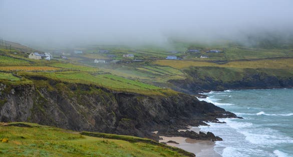 photo of A small village near the dramatic coastline and beach of Coumeenoole in Co Kerry Ireland