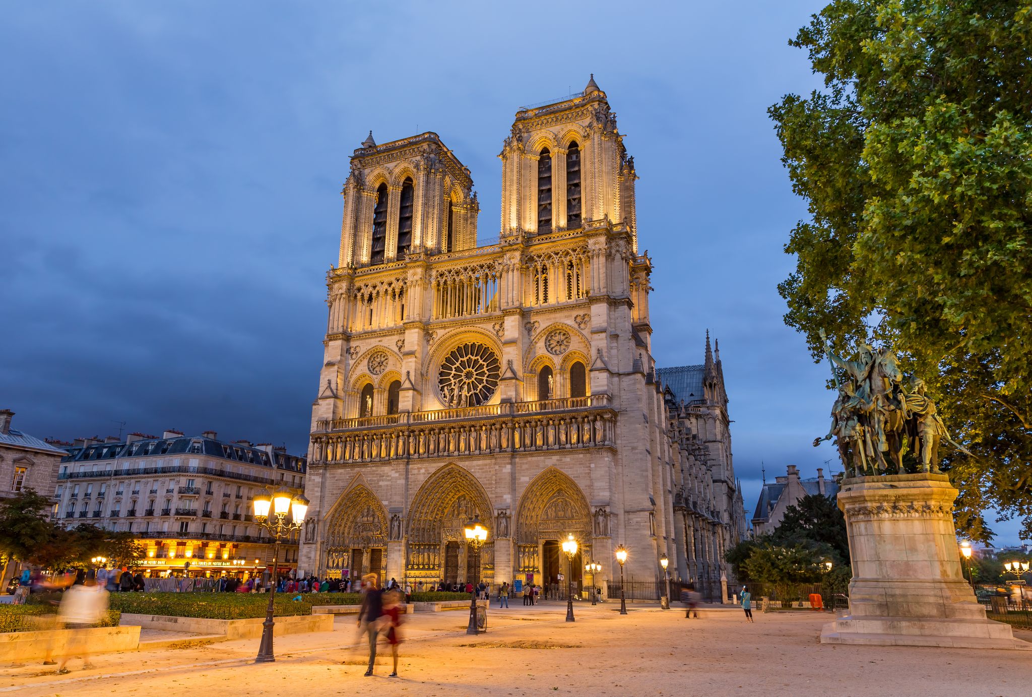 Photo of Notre Dame cathedral in Paris at night, France.