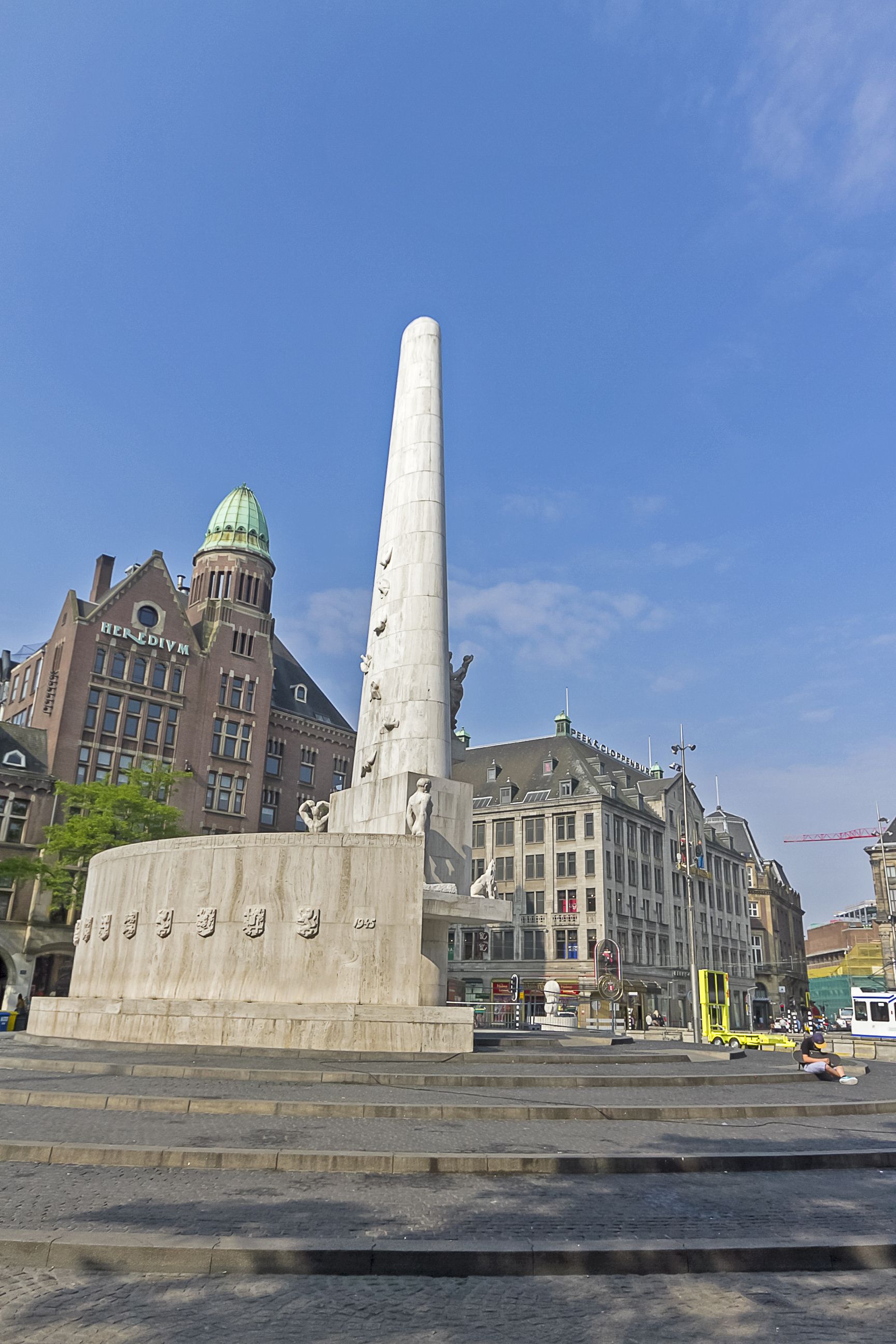 photo of The National Monument on the Dam and in the background the Royal Palace in Amsterdam the Netherlands.