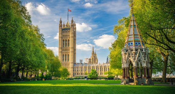 Photo of Westminster Abbey viewed from Victoria tower gardens, London, UK.