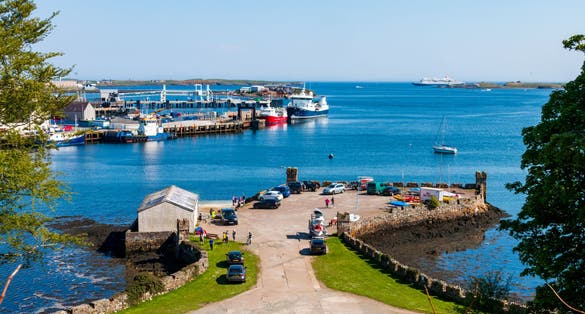 photo of Stornoway Harbor on the Isle of Lewis in Scotland in the sun.