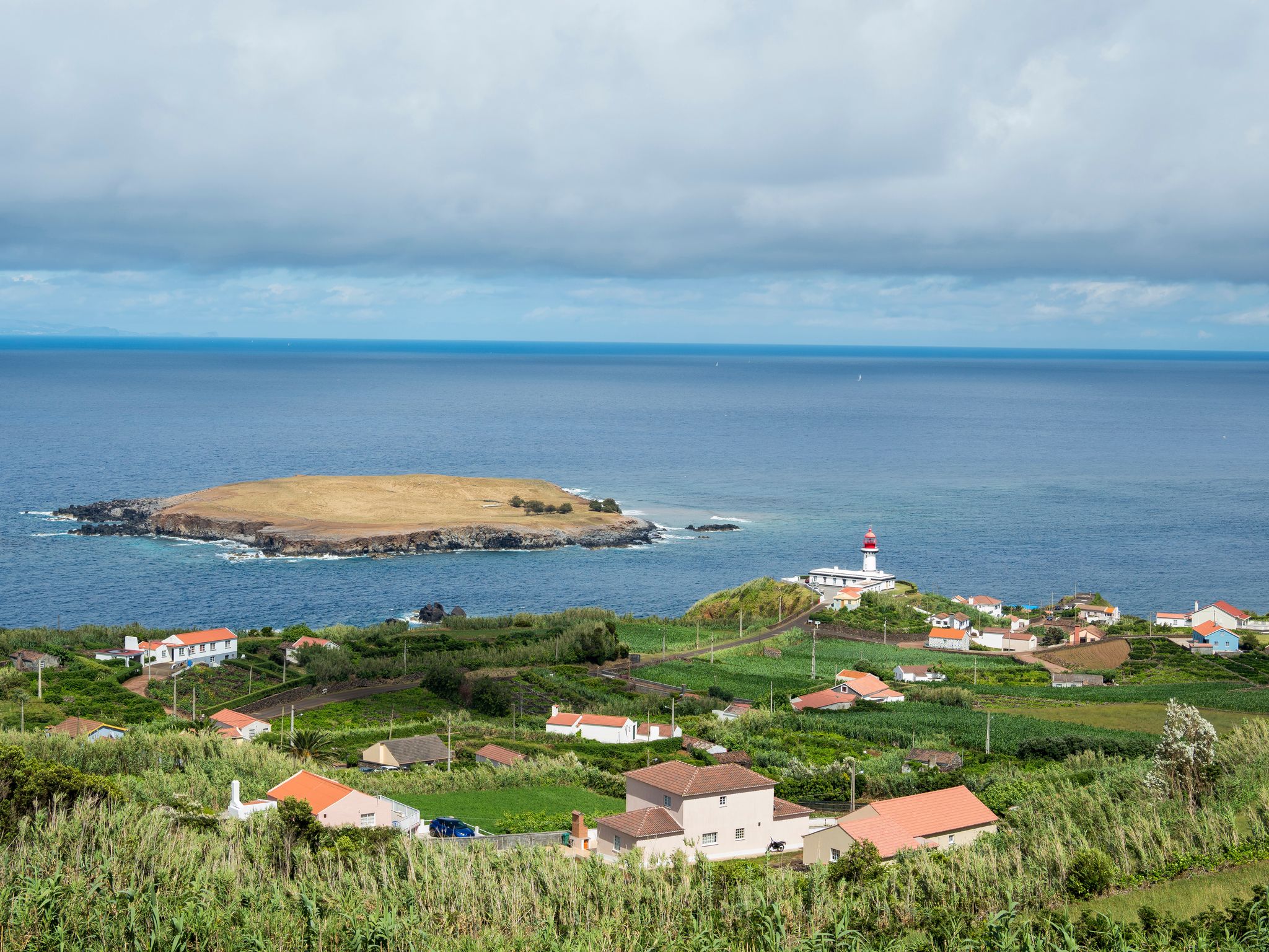 Photo of Ponta do Topo with lighthouse, at the eastern part of the island. Sao Jorge Island, Azores, Portugal.