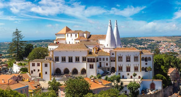 Photo of Palace of Sintra (Palacio Nacional de Sintra) in Sintra in a beautiful summer day, Portugal.